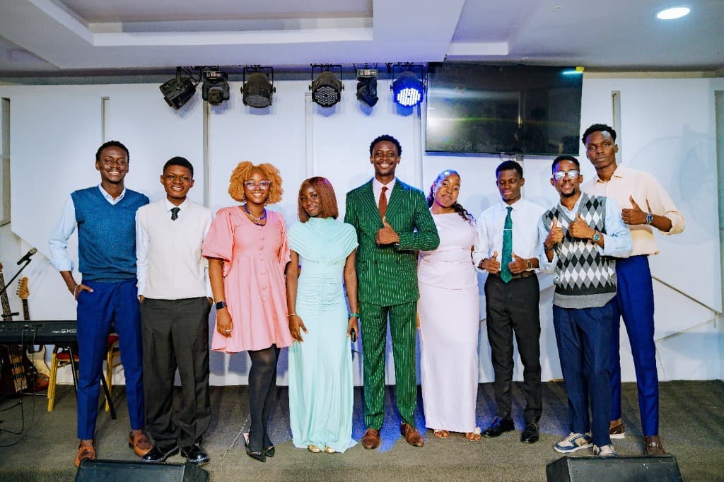 The Scepter community standing together on stage