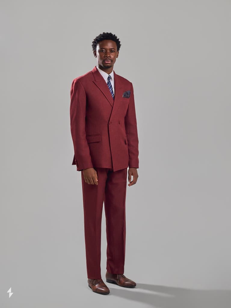 Precious Alo, founder of The Scepter, in a burgundy double-breasted suit
